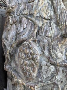 Hand Carved Petrified Wood - Peacock Atop Grape Vine - Image 4