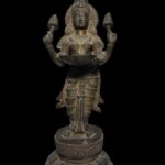 Old Brass Lakshmi Stands Atop Lotus Base